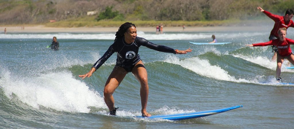 Traveler learning to surf during a Costa Rica surf lesson